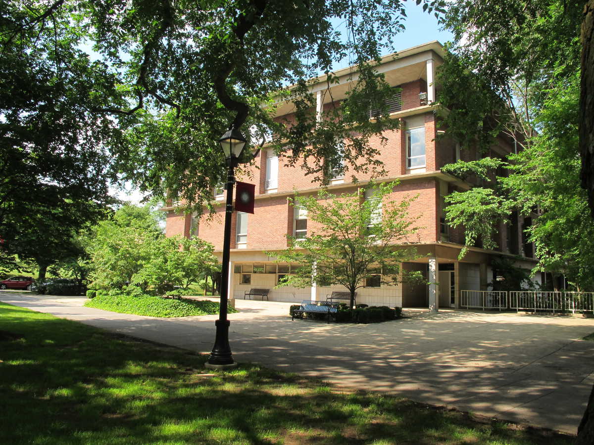 Rutgers campus, a building situated among some trees